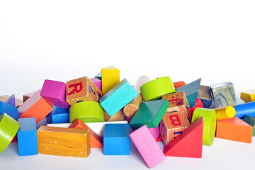 Naklejka premium wooden constructions for children play wooden colored blocks, construction game, part of a series, closeup