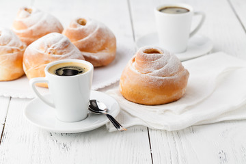 Coffee white cup, croissants on dark retro background, selective focus. Breakfast concept