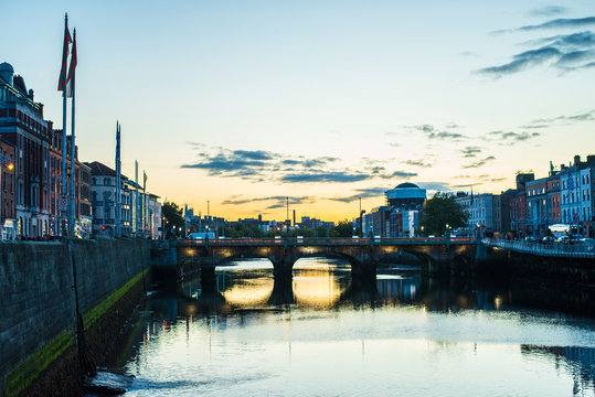 Dublin reflection into hte Liffey river at sunset