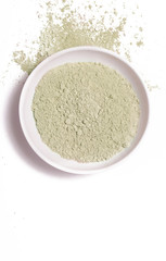 Cosmetic clay powder in the plastic container