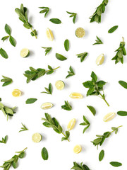 Pattern of citrus fruits. Slices of lemon, lime and mint on a white background. Top view, flat lay.
