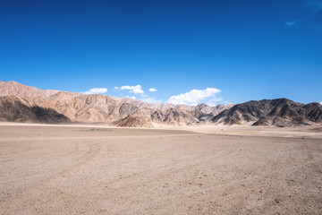 Fototapeta na wymiar Landscape image of mountains and blue sky background in Ladakh , India