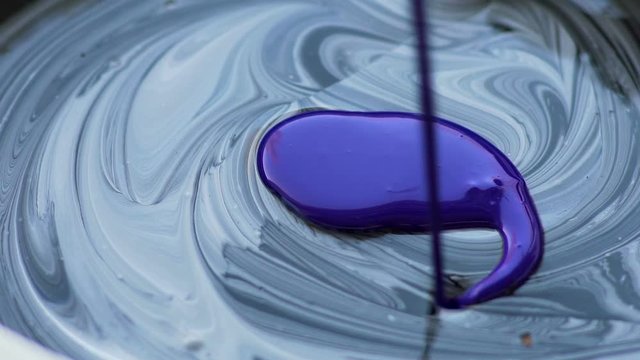 Painter adding bright color to finished mixture, creating masterpiece, impromptu