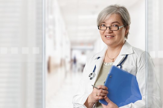 Mature female doctor on hospital corridor