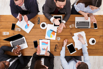 Satisfied multiethnic busy business people clapping hands cheering successful reporter in office,...