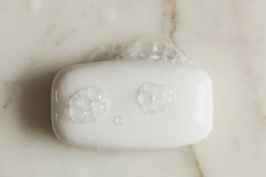 wet bar of soap with bubbles