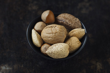 Bowl of whole mixed nuts in the shell