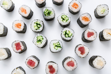 Fototapeta Top view on sushi rolls, maki on white background obraz