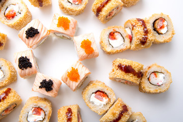 Top view on japanese sushi rolls,maki on white background