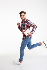 Full length portrait of a smiling young male student