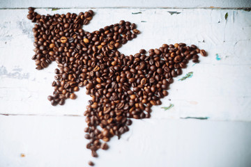christmas tree made from green ribbon on wooden background.