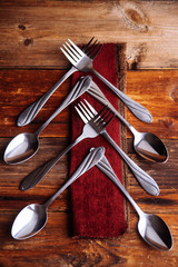 Abstract christmas tree made from cutlery on a dark slate,grey stone or concrete background.Top view with copy space.