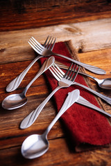 Abstract christmas tree made from cutlery on a dark slate,grey stone or concrete background.Top view with copy space.