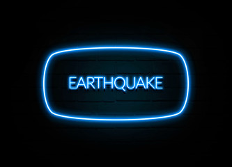 Earthquake  - colorful Neon Sign on brickwall