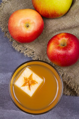 Glass of cider. Apple cider and fruits. Apple drink, cocktail, beverage, juice. View from above, top studio shot, vertical