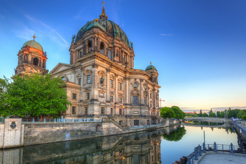 Fototapeta na wymiar Berlin Cathedral (Berliner Dom) reflected in Spree River at dawn, Germany