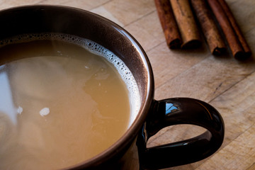Masala Chai Tea in a big brown Cup.