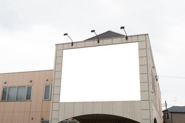 Large blank billboard on a street wall, banners with room to add your own text