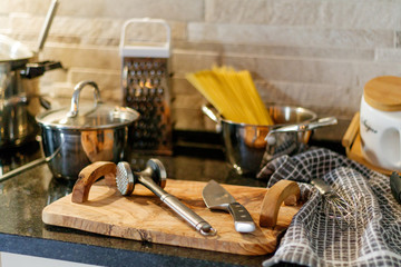 Fototapeta na wymiar Kitchen utensils on wooden table knives spaghetti pasta