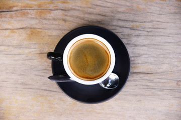 black coffee in black coffee cup for breakfast or coffee break time on wooden table