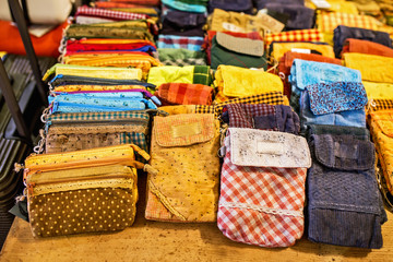 Vintage classic style of female fabric purse for sale at showcase in a shop