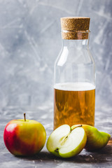Apple cider in a bootle. Selective focus, space for text.