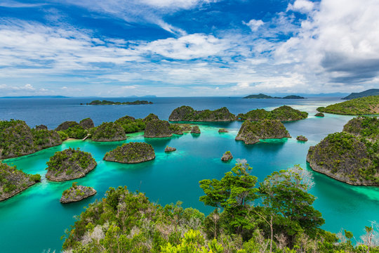 Pianemo Islands, Blue Lagoon with Green Rockes, Raja Ampat, West Papua. Indonesia