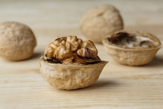 Close-up of walnuts on wooden background