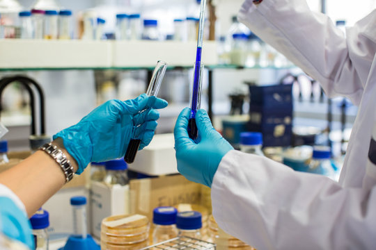 Close Up of Hands Working in a Chemistry Lab