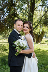 Portrait of a young couple. Wedding photo outdoor of loving couple