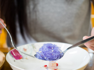 Asian woman enjoy eating delicious meal