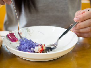 Asian woman enjoy eating delicious meal