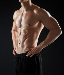 Fototapeta na wymiar close up of man or bodybuilder with bare torso
