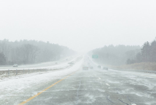Driving down Highway in Snowstorm