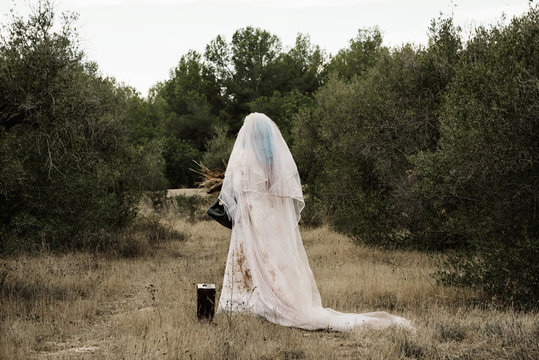 scary bride seen from behind outdoors