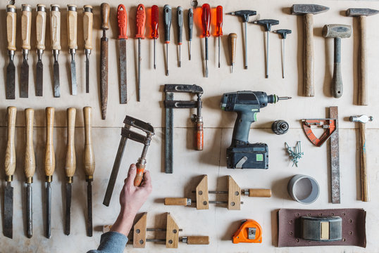 Man's hand holding a tool for woodworking