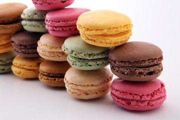 Fototapeta premium Sweet and colourful french macaroons or macaron on white background, Dessert