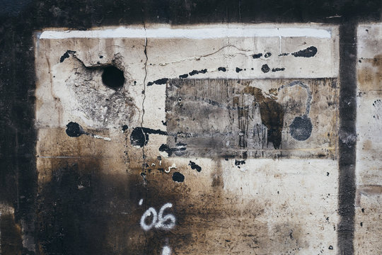 Detail of painted, old and weathered wall of demolished building
