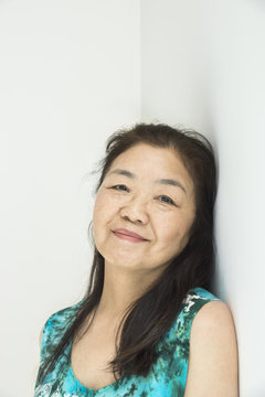 Senior Asian woman portrait with white background