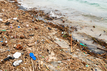 Pollution Problem - plastic, containers and other debris polluting the ocean and beach