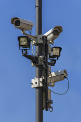 Surveillance camera under a blue sky