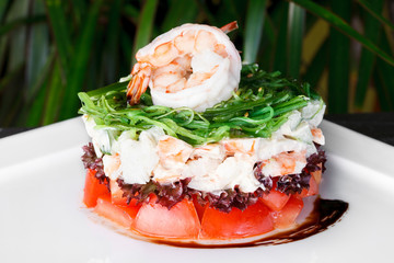Prawn salad with seaweed. Delicious and healthy salad of shrimps, mixed greens and tomatoes. Сlose-up
