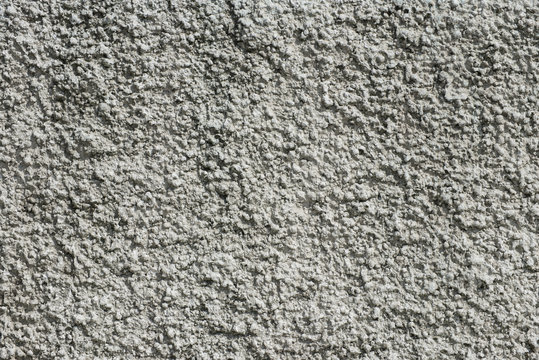 white rough plaster with decorative structure at a wall