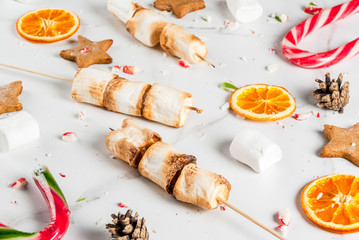 Creamy mushroom pasta with cheese and basil, in portioned frying pan, on white marble table, copy space