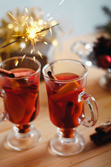 Beautiful Christmas mulled wine in a glass in decorating  New Year interior background