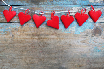 Red hearts on wooden background.Valentines day greeting card.Top view with copy space