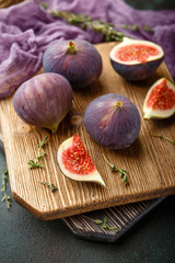 Juicy fig fruits on a dark background