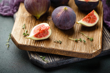 Juicy fig fruits on a dark background