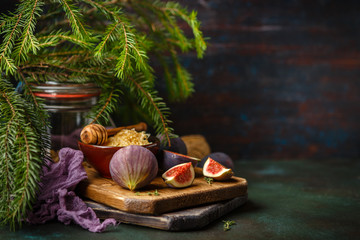 Juicy fig fruits on a dark background