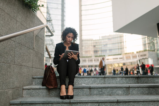 Businesswoman using a digital tablet in the financial district